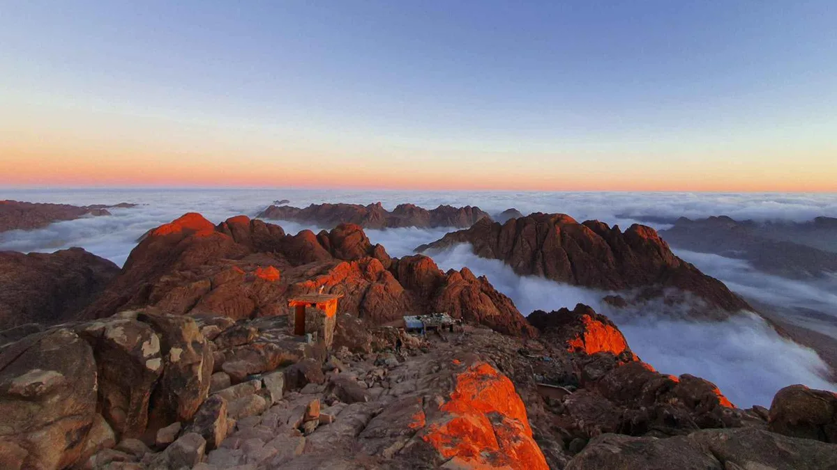 Bedouin guide and hiker on the stone steps of Mount Sinai before dawn on a private St Catherine's Monastery tour, Egypt